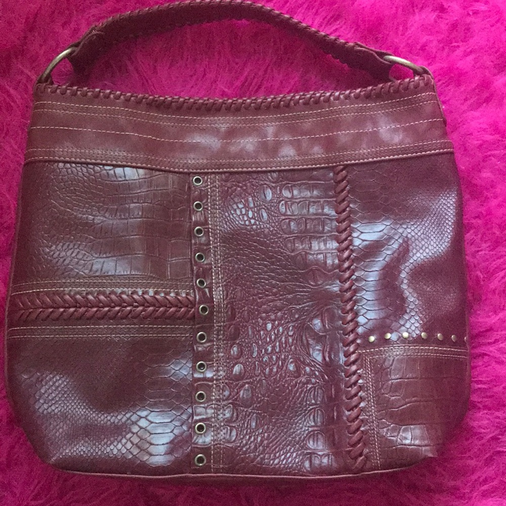 Pocket book, burgundy in color, soft leather.